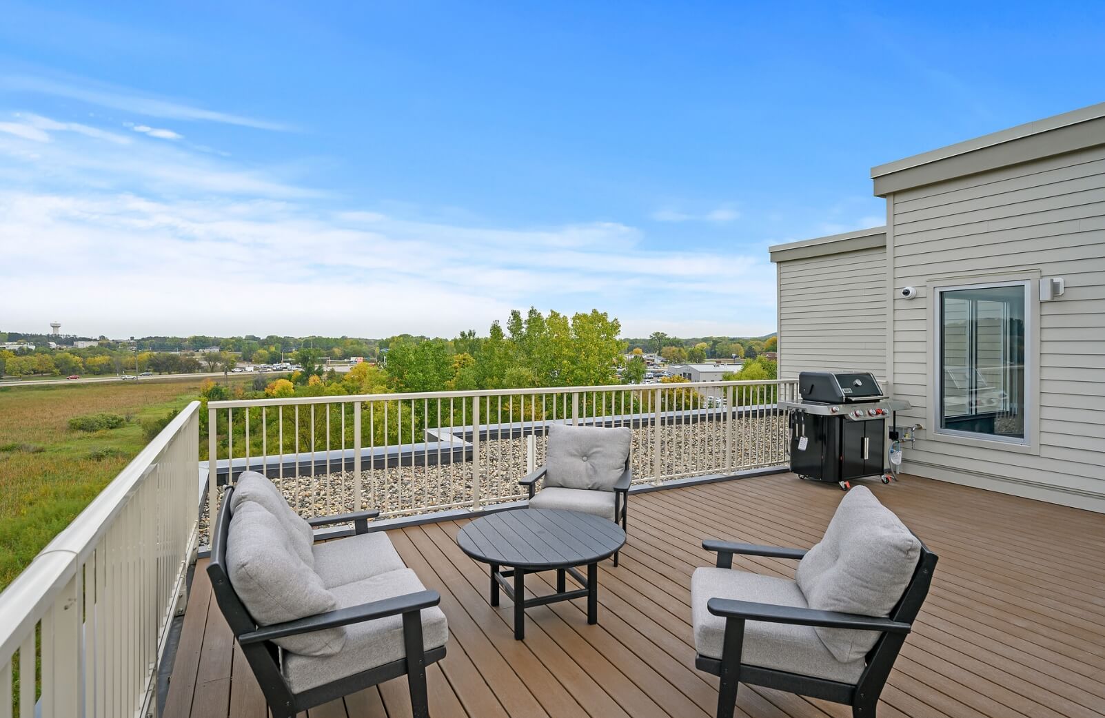 a triangle of chairs on the rooftop seating area